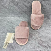 Soft plush slippers with short fur on the sole
