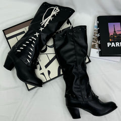 Tasseled long boots made of leather
