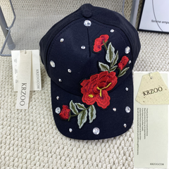 Rose-colored hat with diamond trim baseball cap