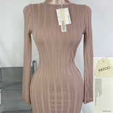 A fitted, ruffled edge knitted long dress