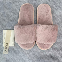 Soft plush slippers with short fur on the sole