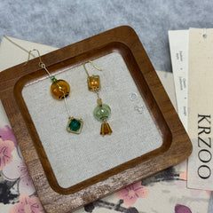 T glass ball asymmetrical long green earrings