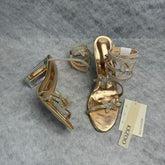 Serpentine-wrapped butterfly platform heels