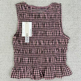 A sleeveless front-back vest