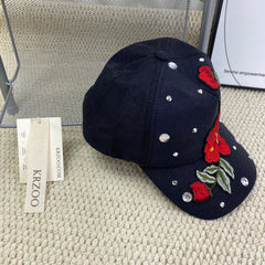Rose-colored hat with diamond trim baseball cap