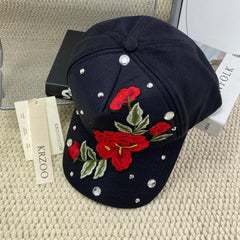 Rose-colored hat with diamond trim baseball cap