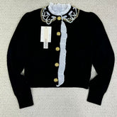 Short-sleeved blazer with ruffled edges