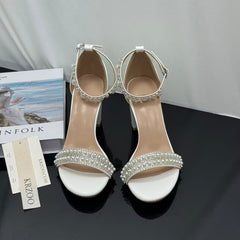 White ankle strap pearl necklace sandals