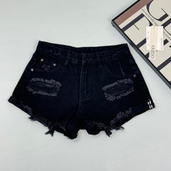 Low-waist fringed denim shorts