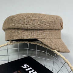 Woven straw cap with a flat top