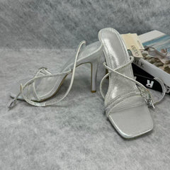 Spiked high-heeled shoes