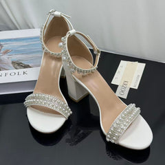White ankle strap pearl necklace sandals