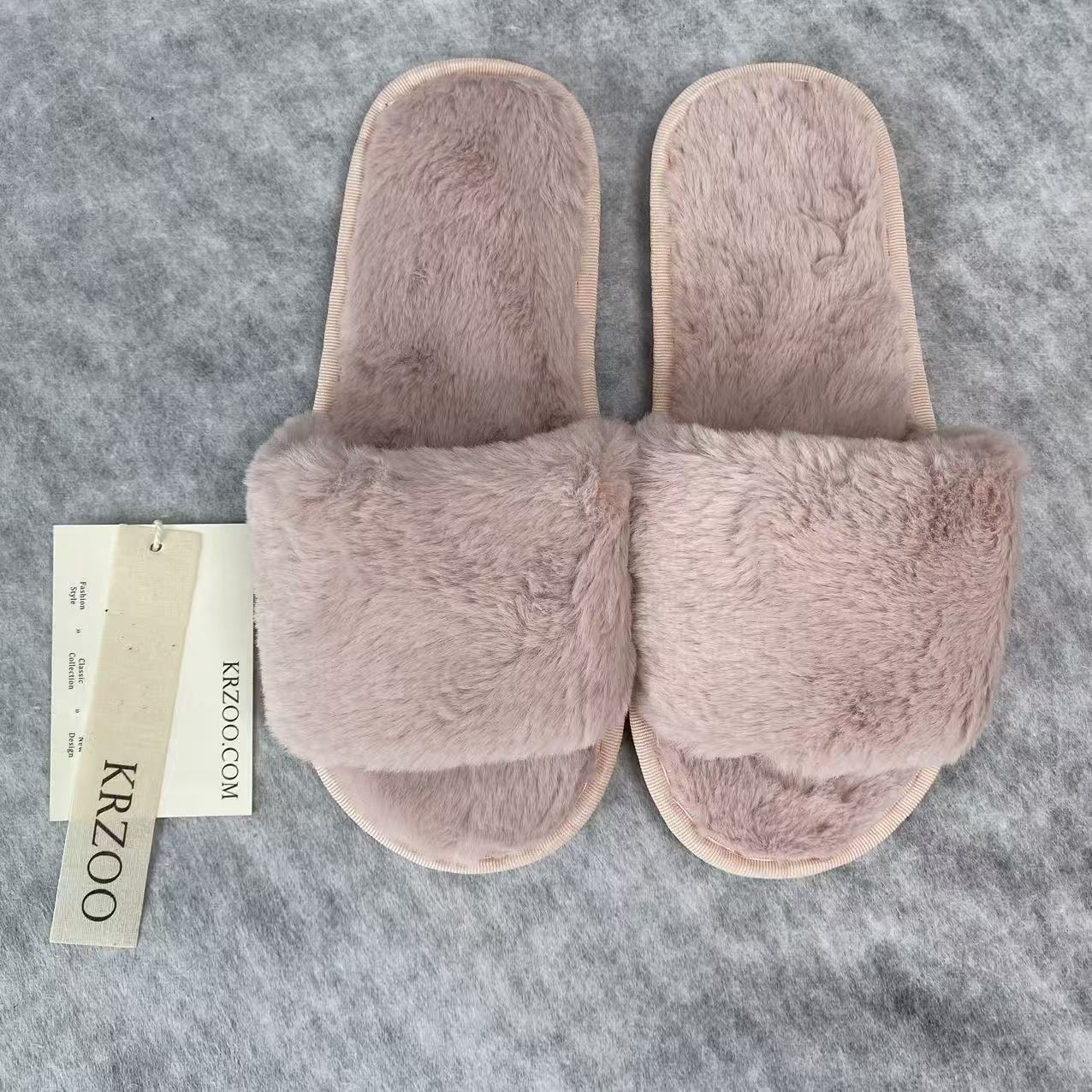 Soft plush slippers with short fur on the sole