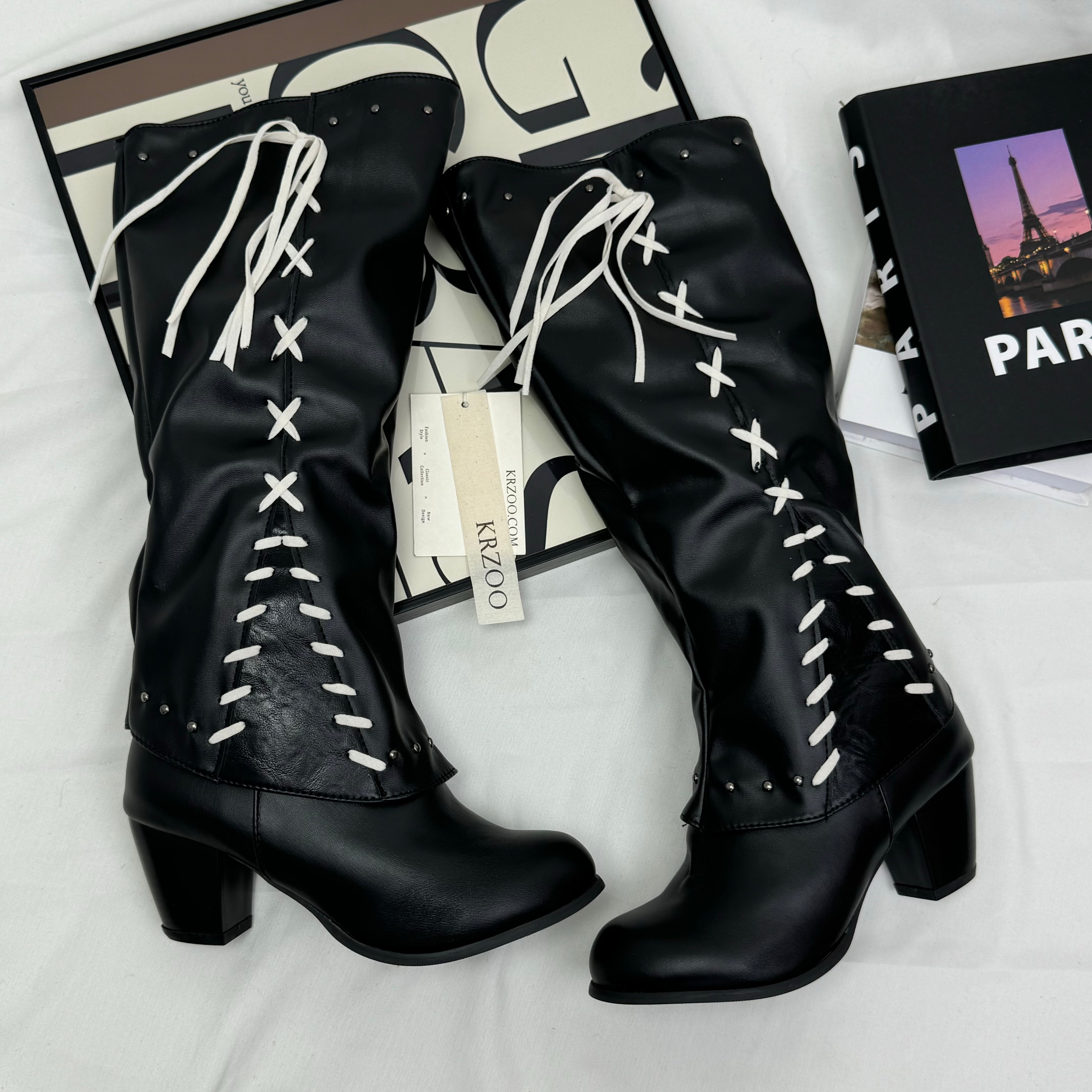 Tasseled long boots made of leather