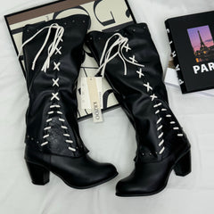 Tasseled long boots made of leather