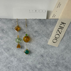 T glass ball asymmetrical long green earrings