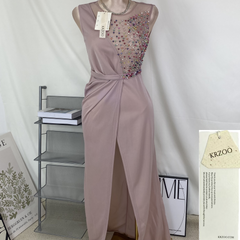 A halter-style and trailing evening dress