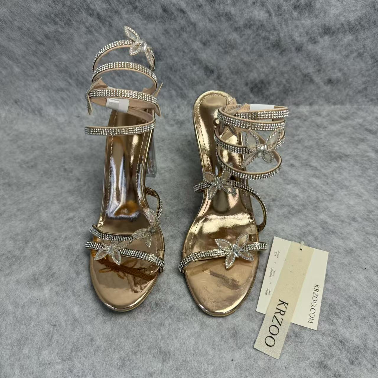 Serpentine-wrapped butterfly platform heels