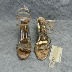 Serpentine-wrapped butterfly platform heels