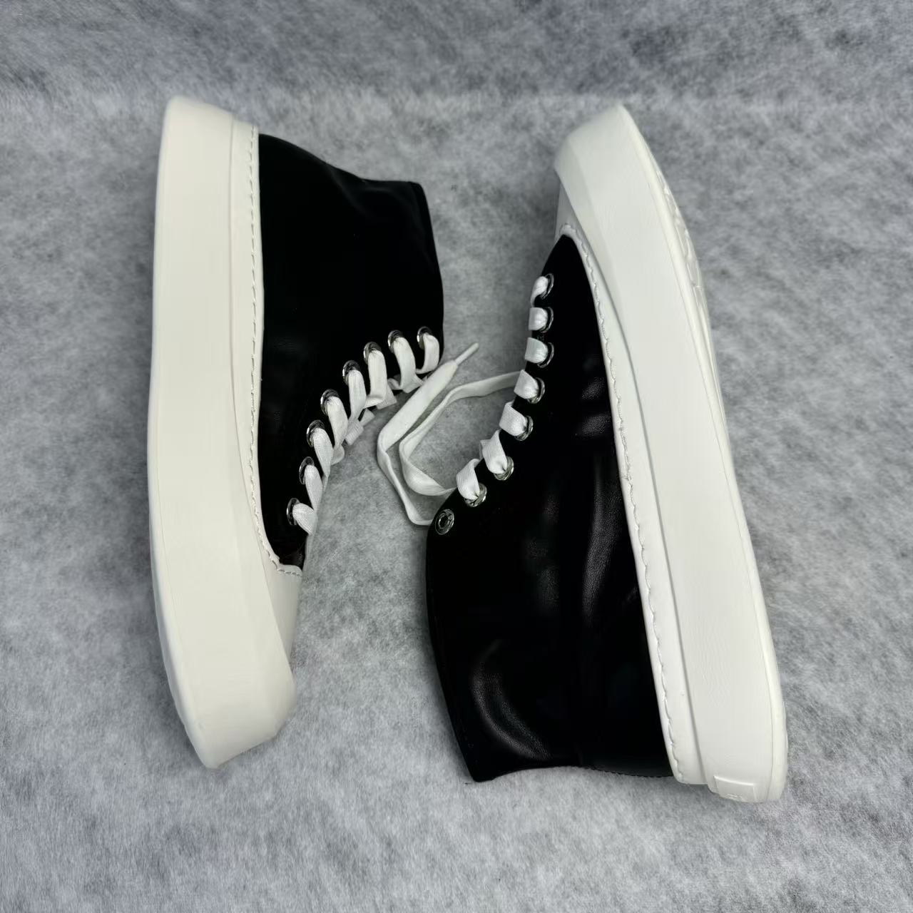 High-top black and white canvas shoes with thick soles