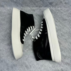 High-top black and white canvas shoes with thick soles