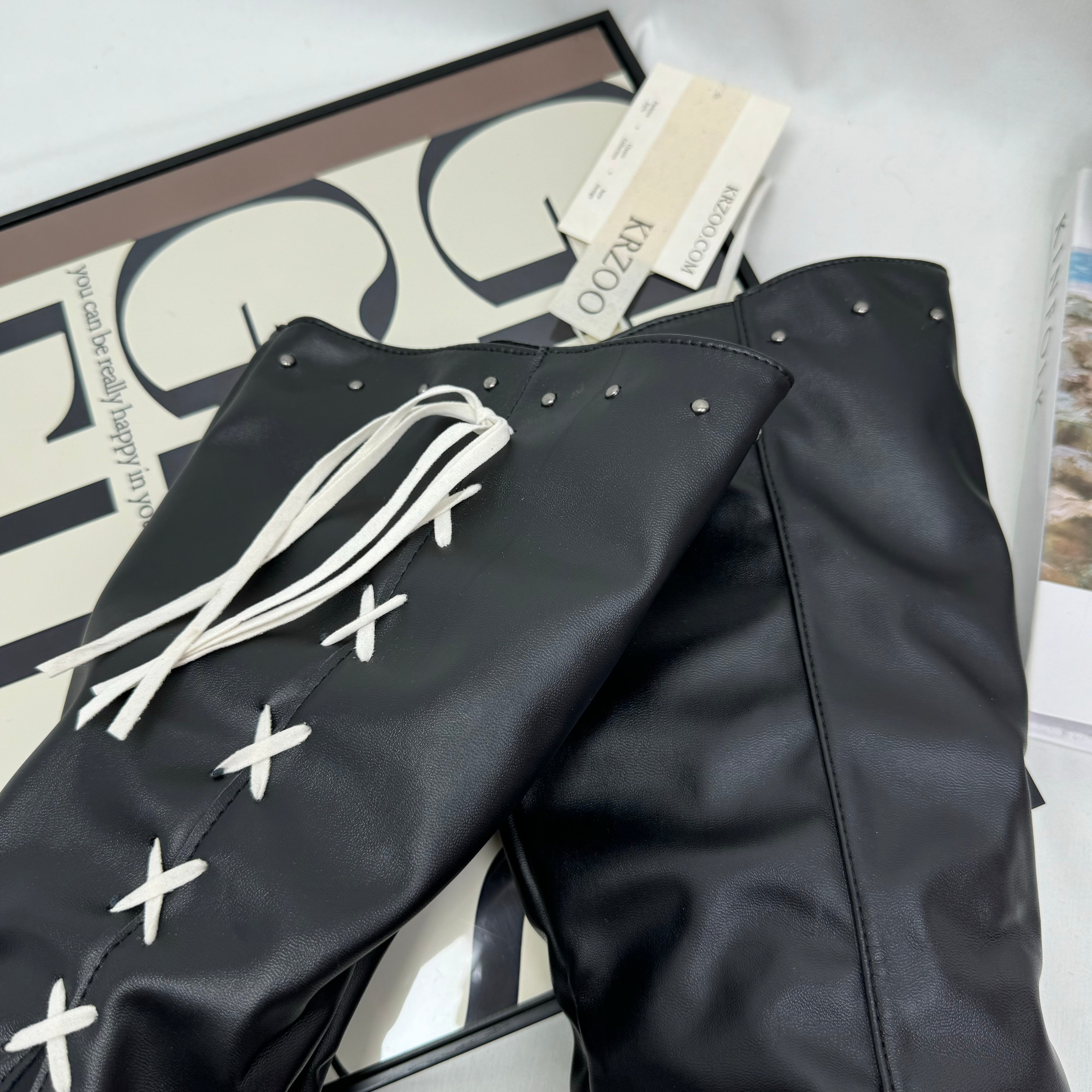 Tasseled long boots made of leather