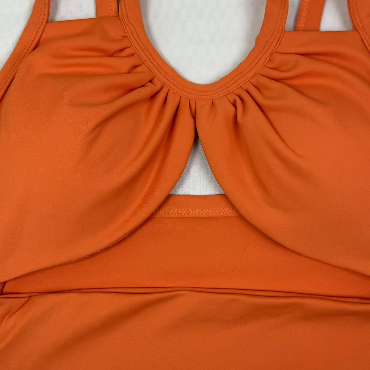 Open-necked top with a draped collar