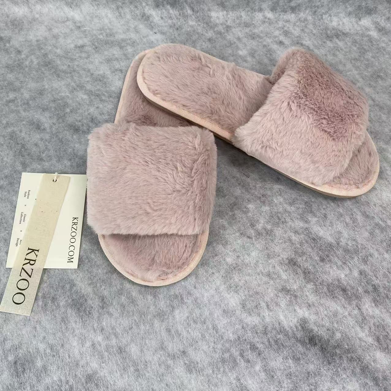 Soft plush slippers with short fur on the sole