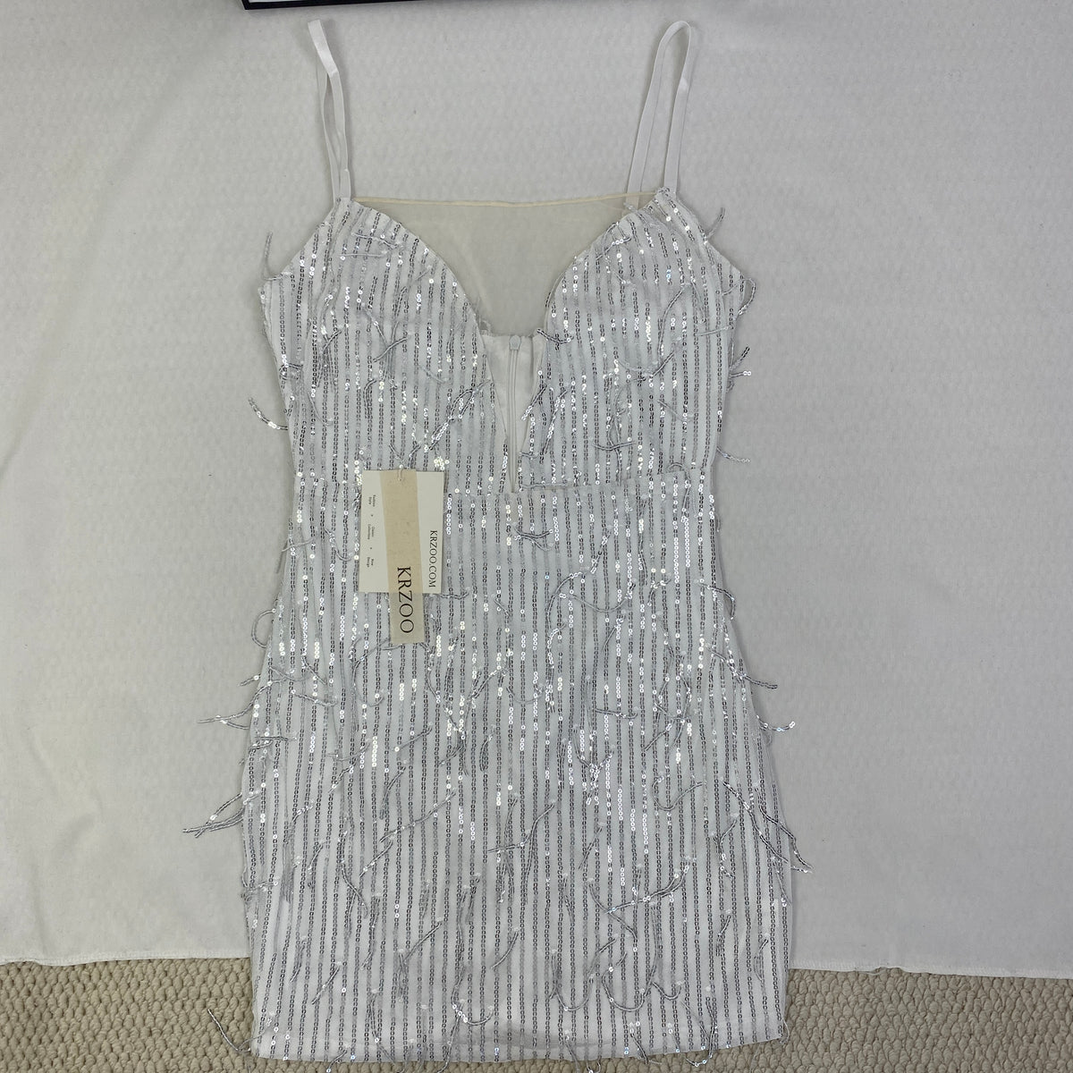 Deep V silhouette fringed halter dress with sequins