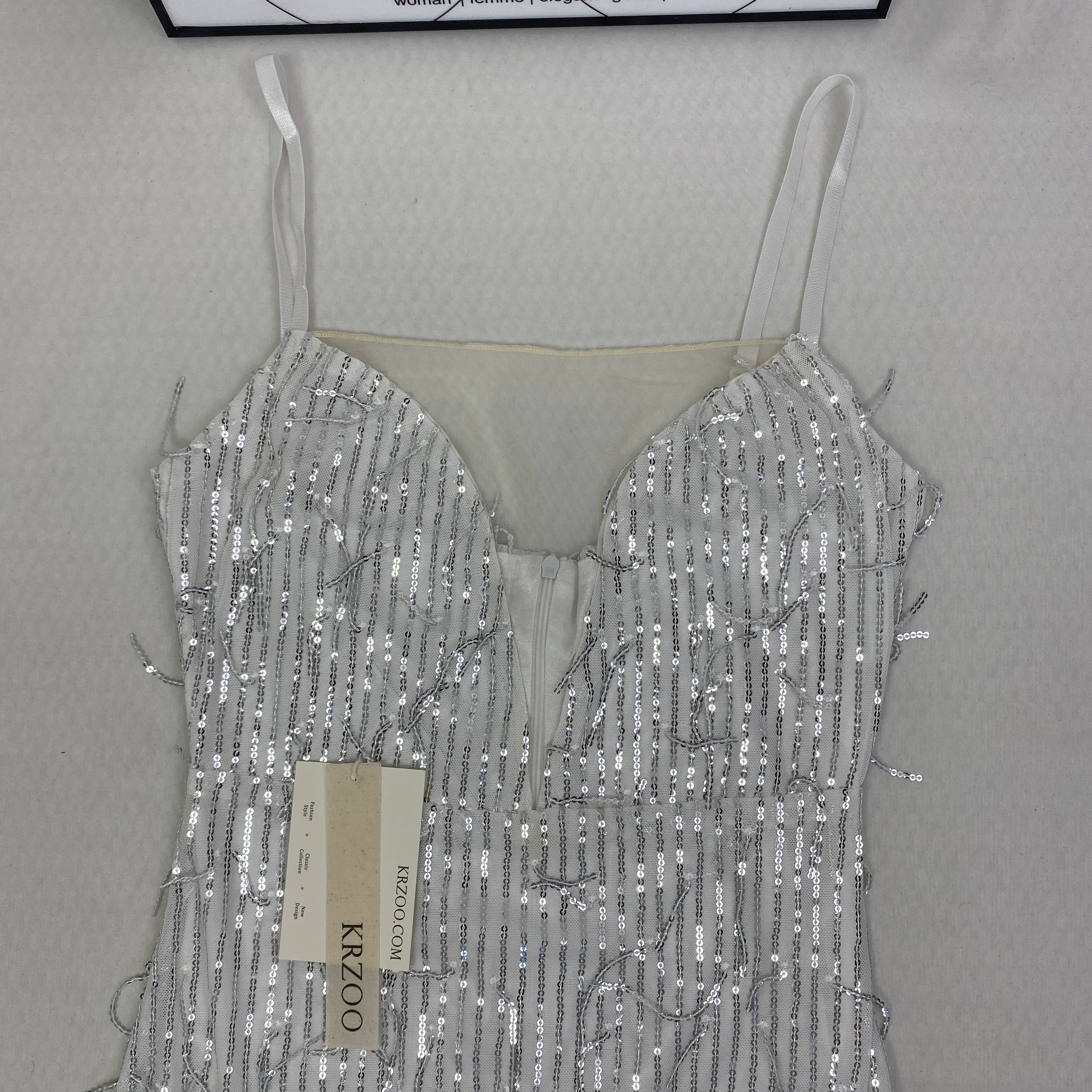 Deep V silhouette fringed halter dress with sequins