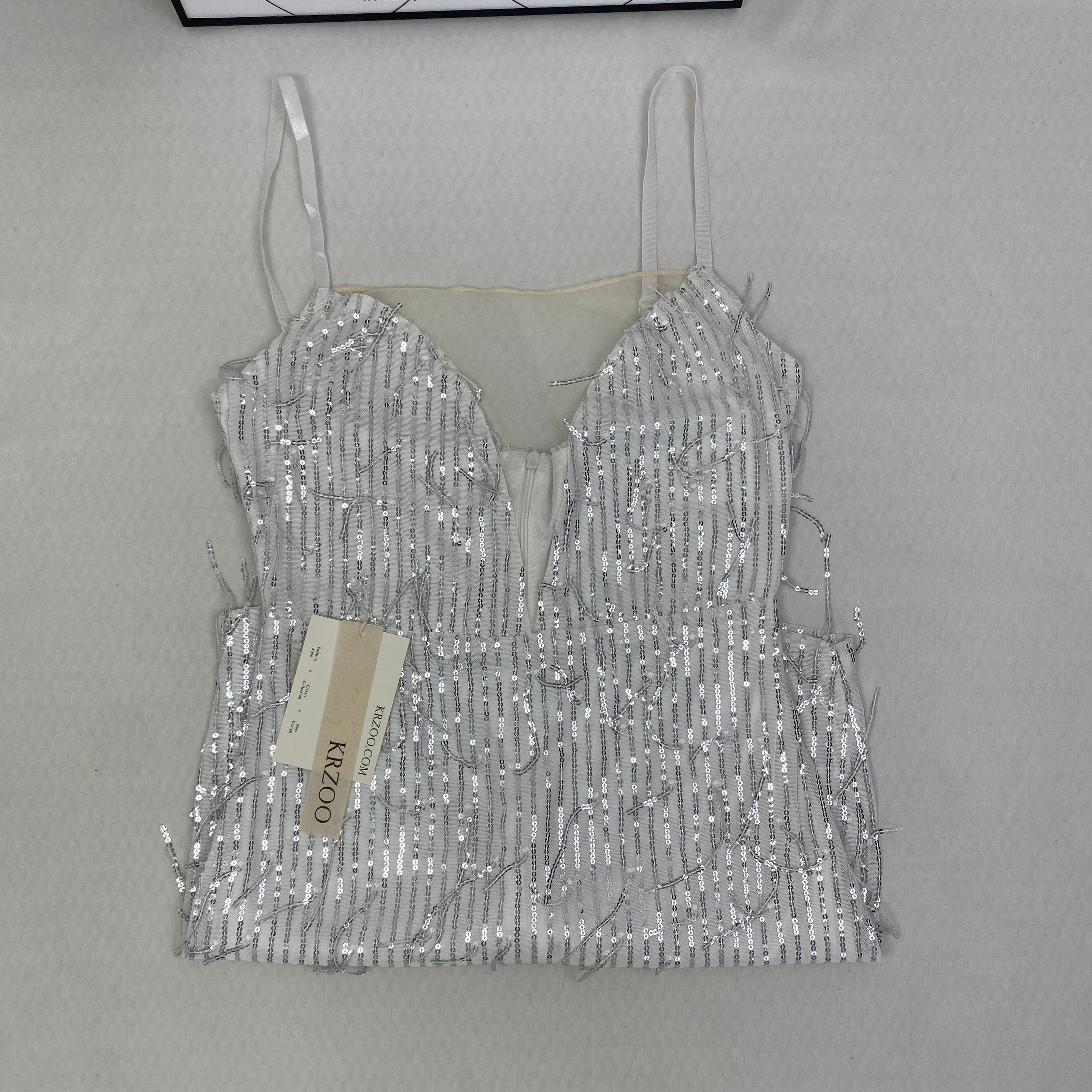 Deep V silhouette fringed halter dress with sequins