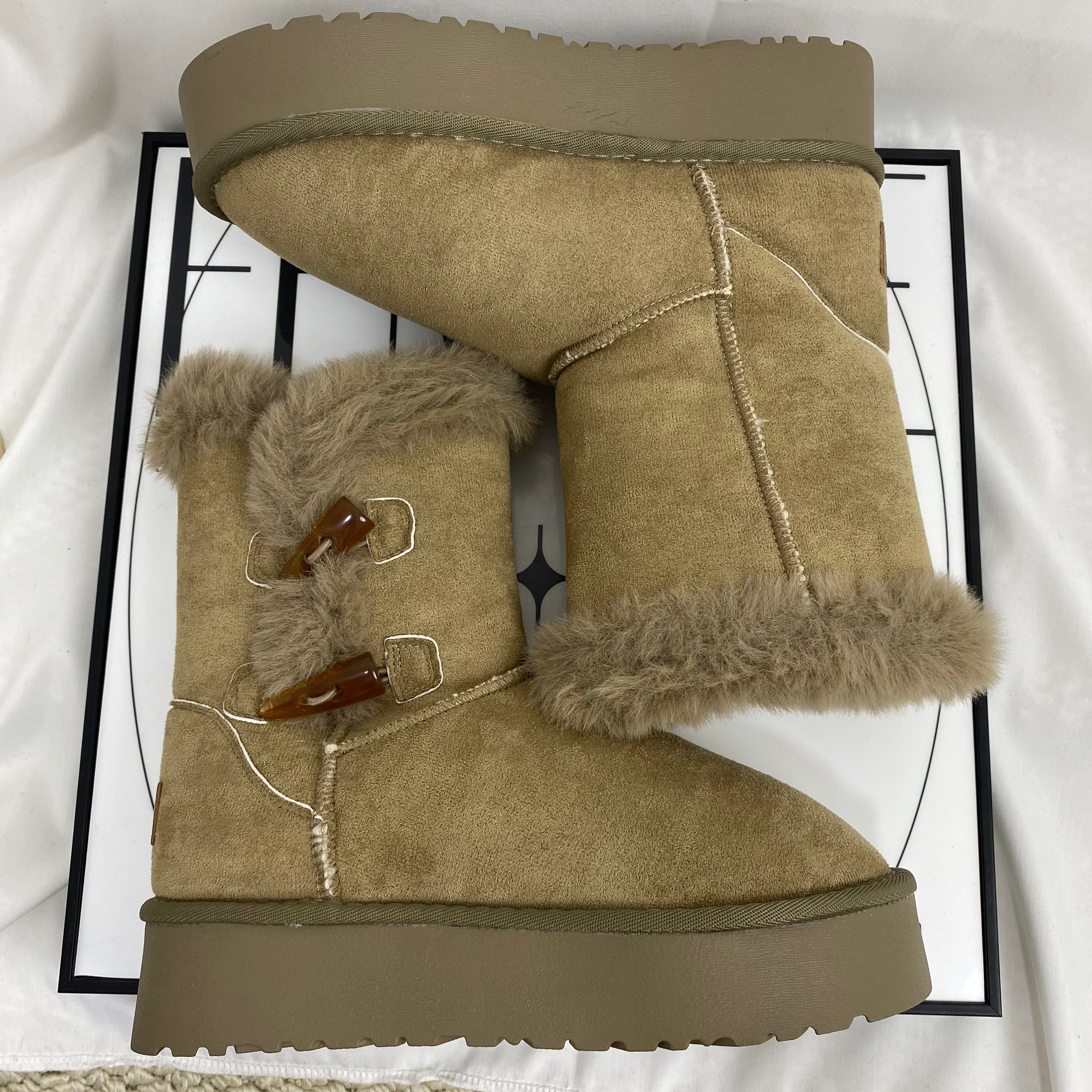 Shearling Horn-Buckled Snow Boots