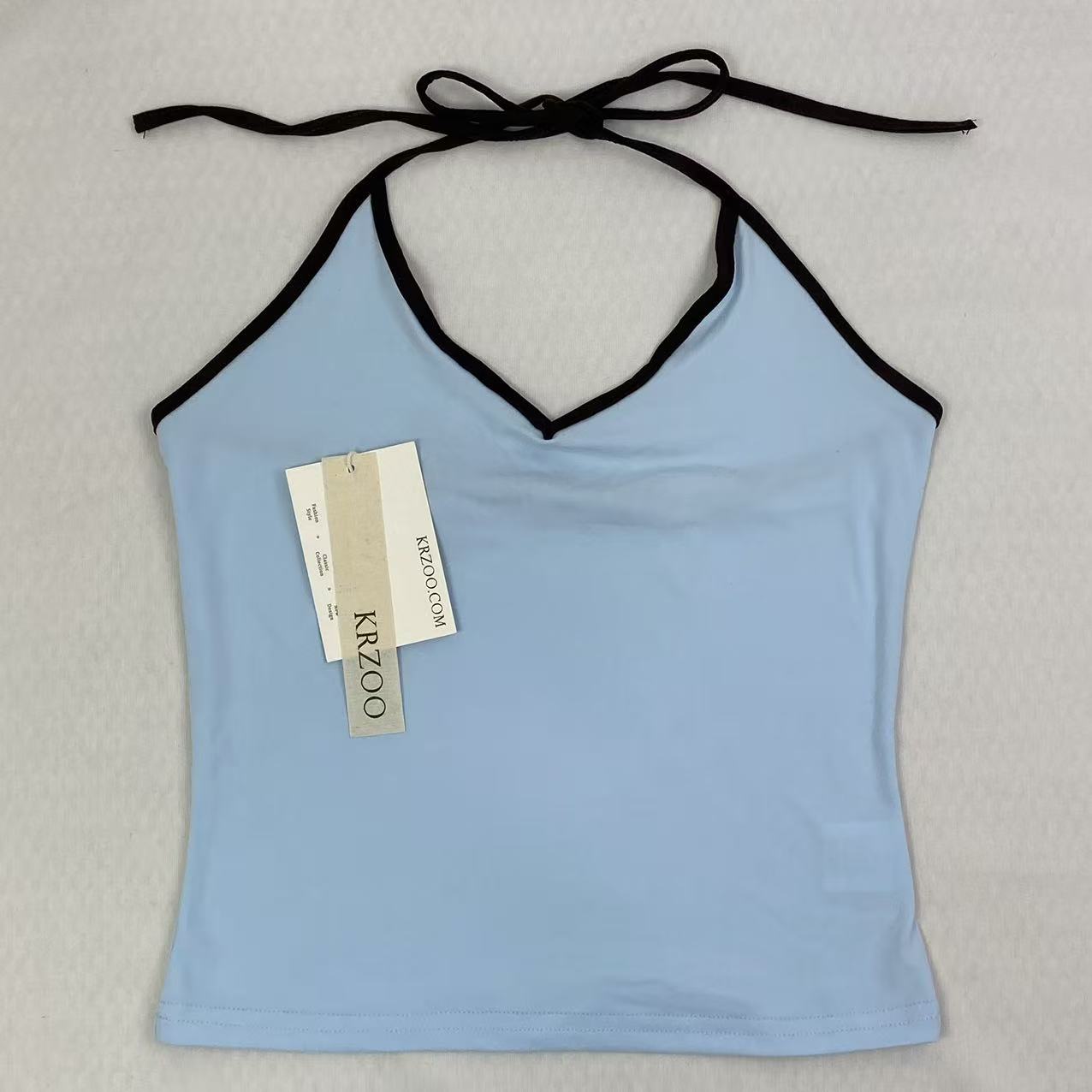 Contrasting color tie-neck sling-neck top