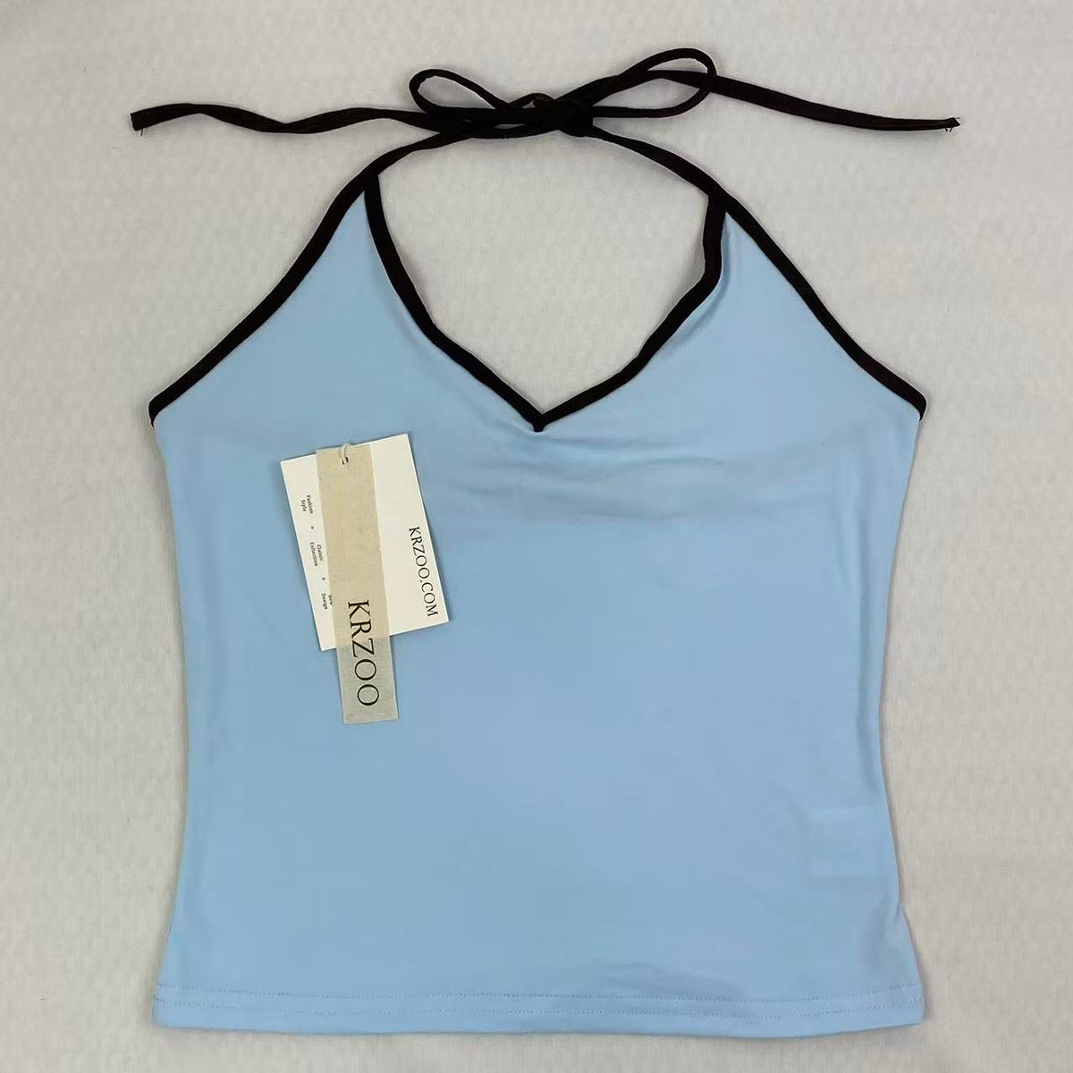 Contrasting color tie-neck sling-neck top