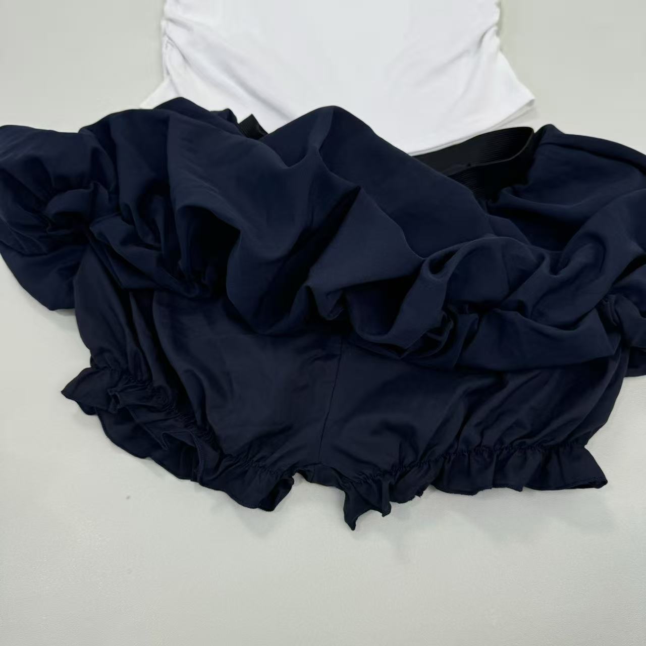 Two navy short-sleeved skirt in a set
