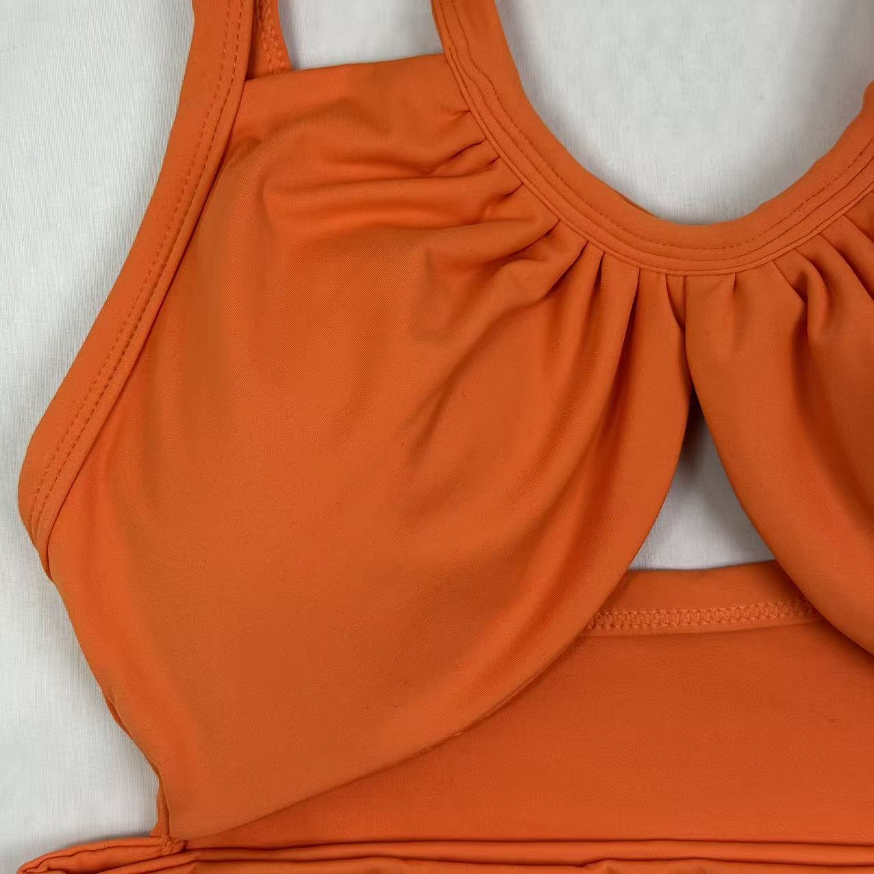 Open-necked top with a draped collar