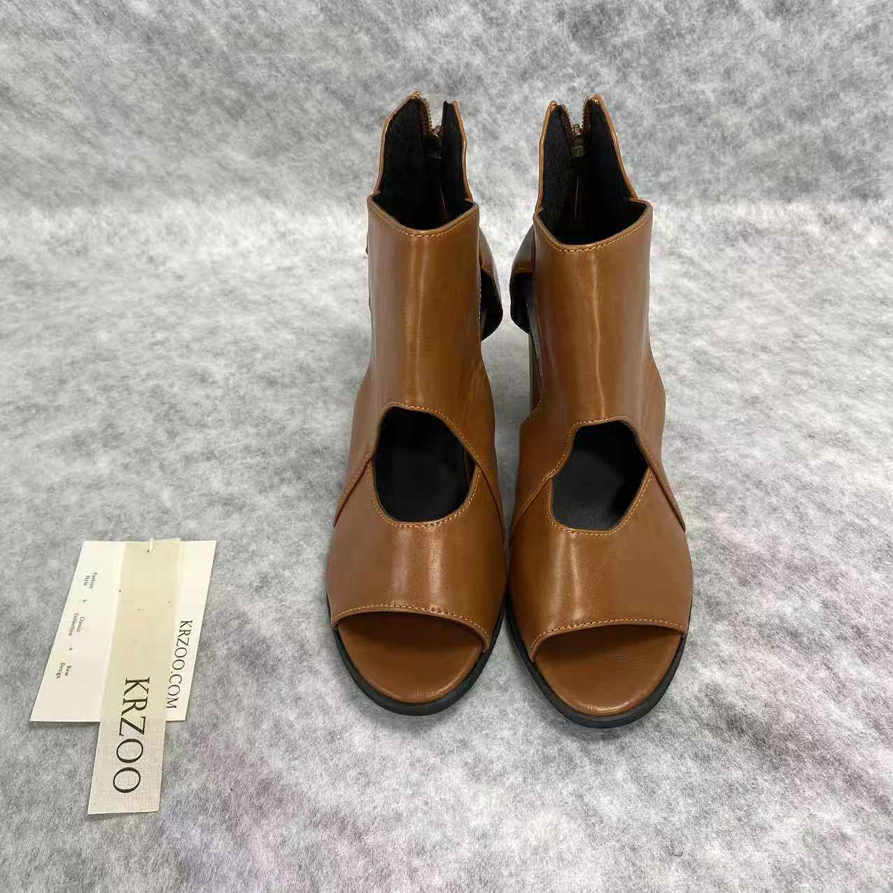 Fish-shaped hollowed-out thick heel high heels