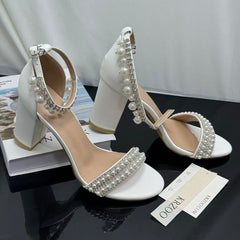 White ankle strap pearl necklace sandals