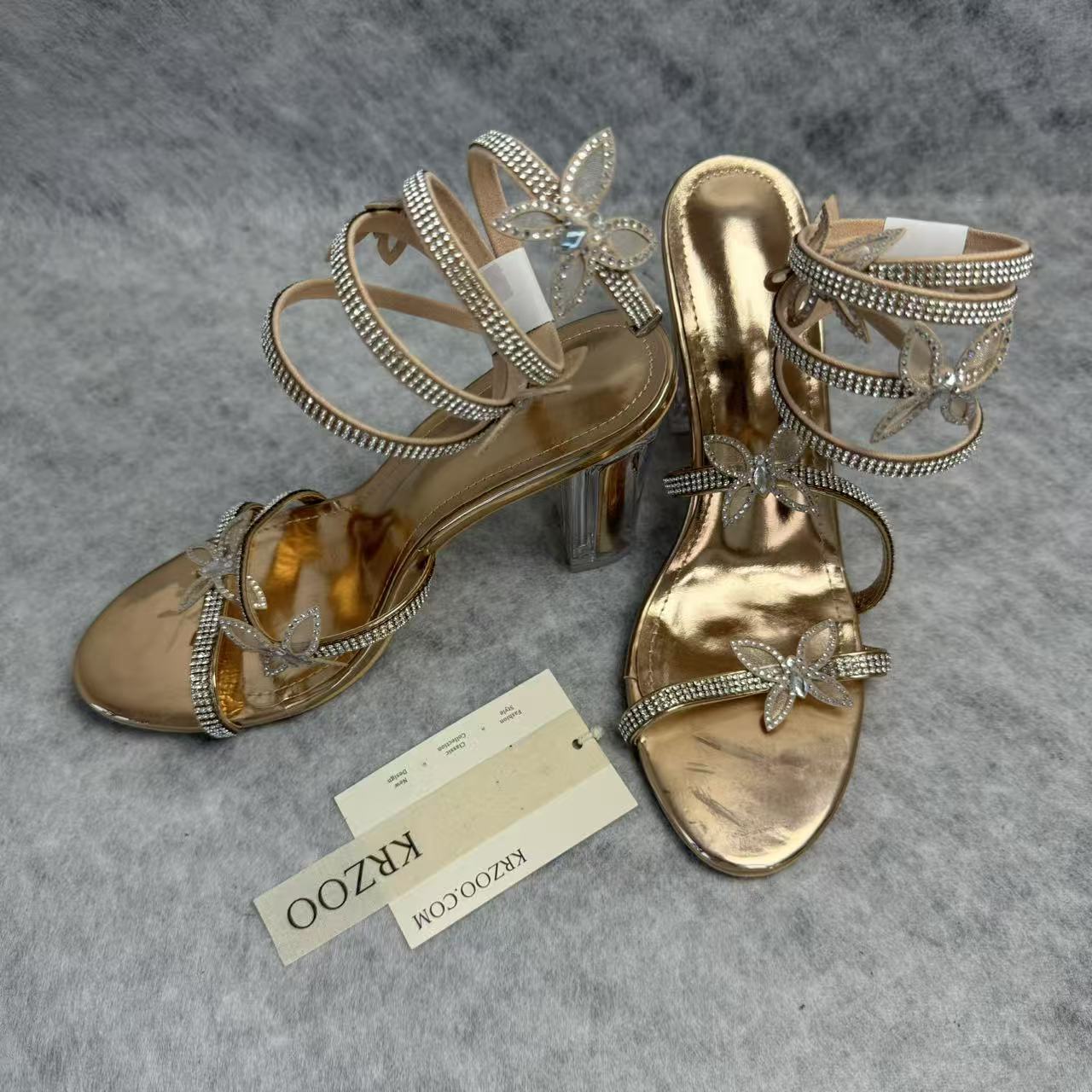 Serpentine-wrapped butterfly platform heels