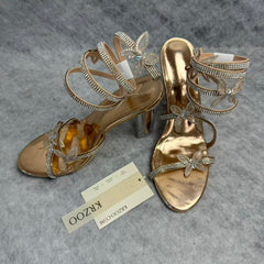 Serpentine-wrapped butterfly platform heels