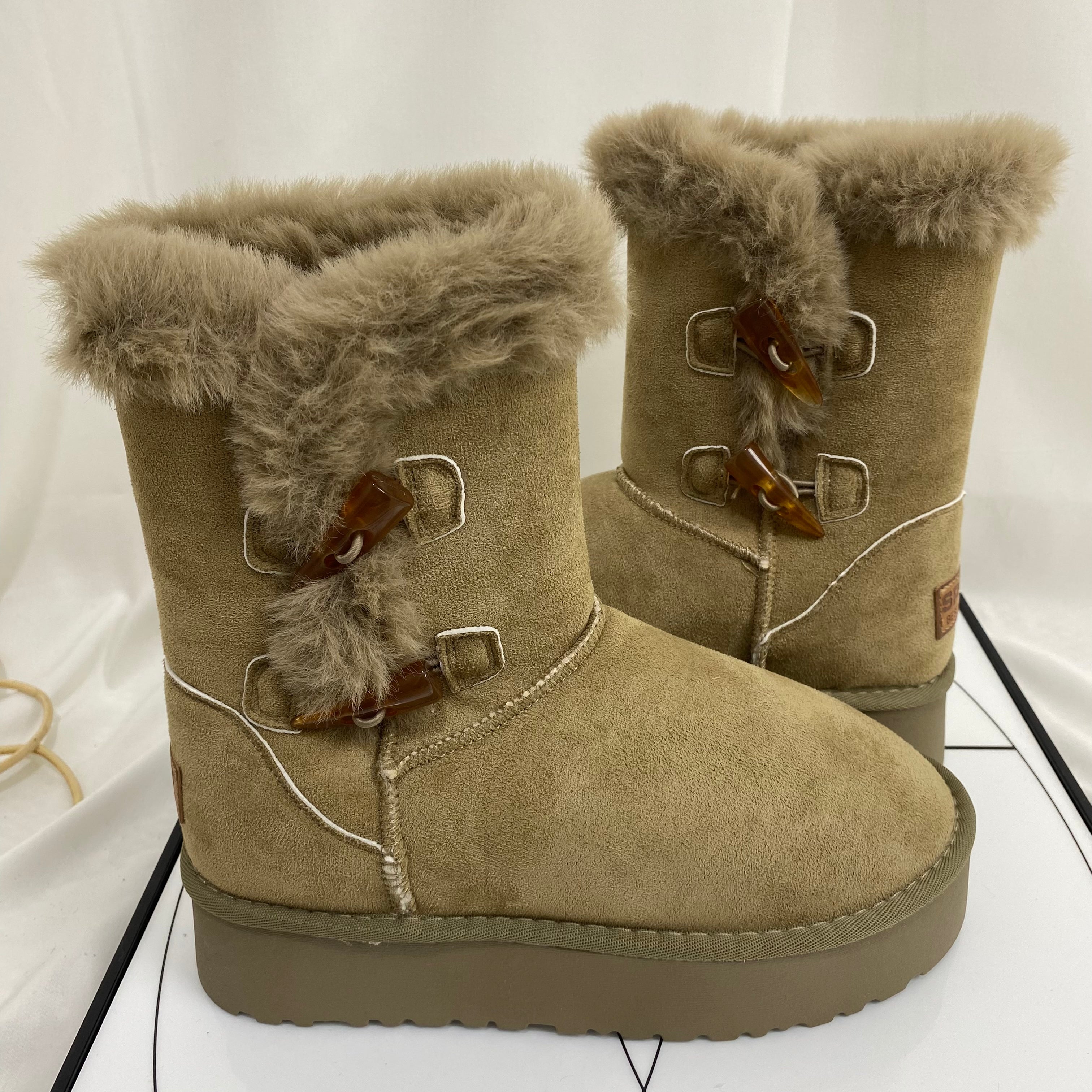 Shearling Horn-Buckled Snow Boots