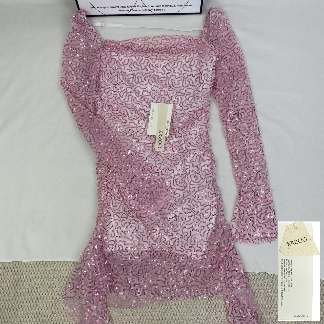A slimming, soft pink, figure-hugging dress
