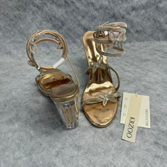 Serpentine-wrapped butterfly platform heels