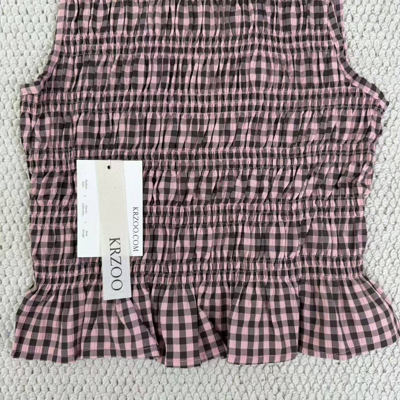 A sleeveless front-back vest