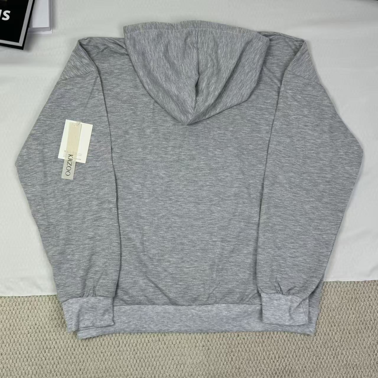 Hooded sweatshirt is loose