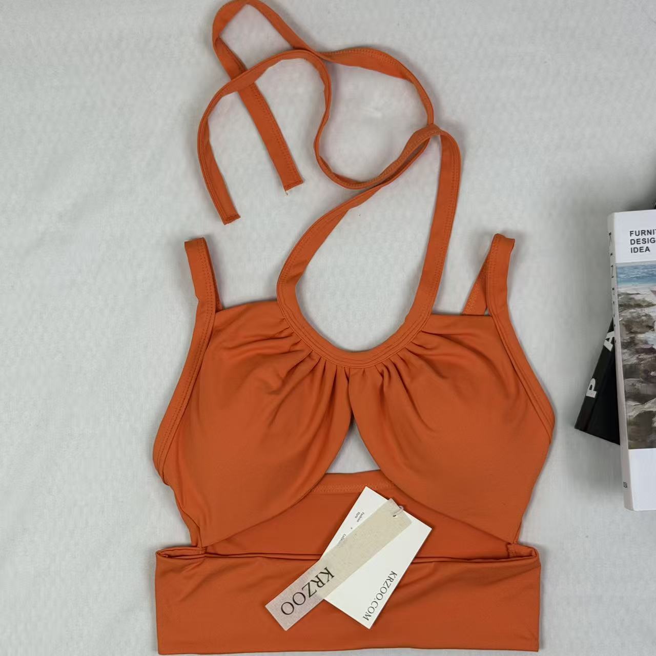 Open-necked top with a draped collar