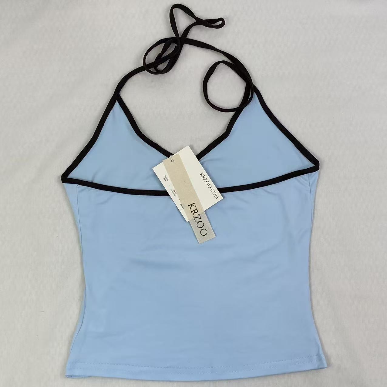 Contrasting color tie-neck sling-neck top