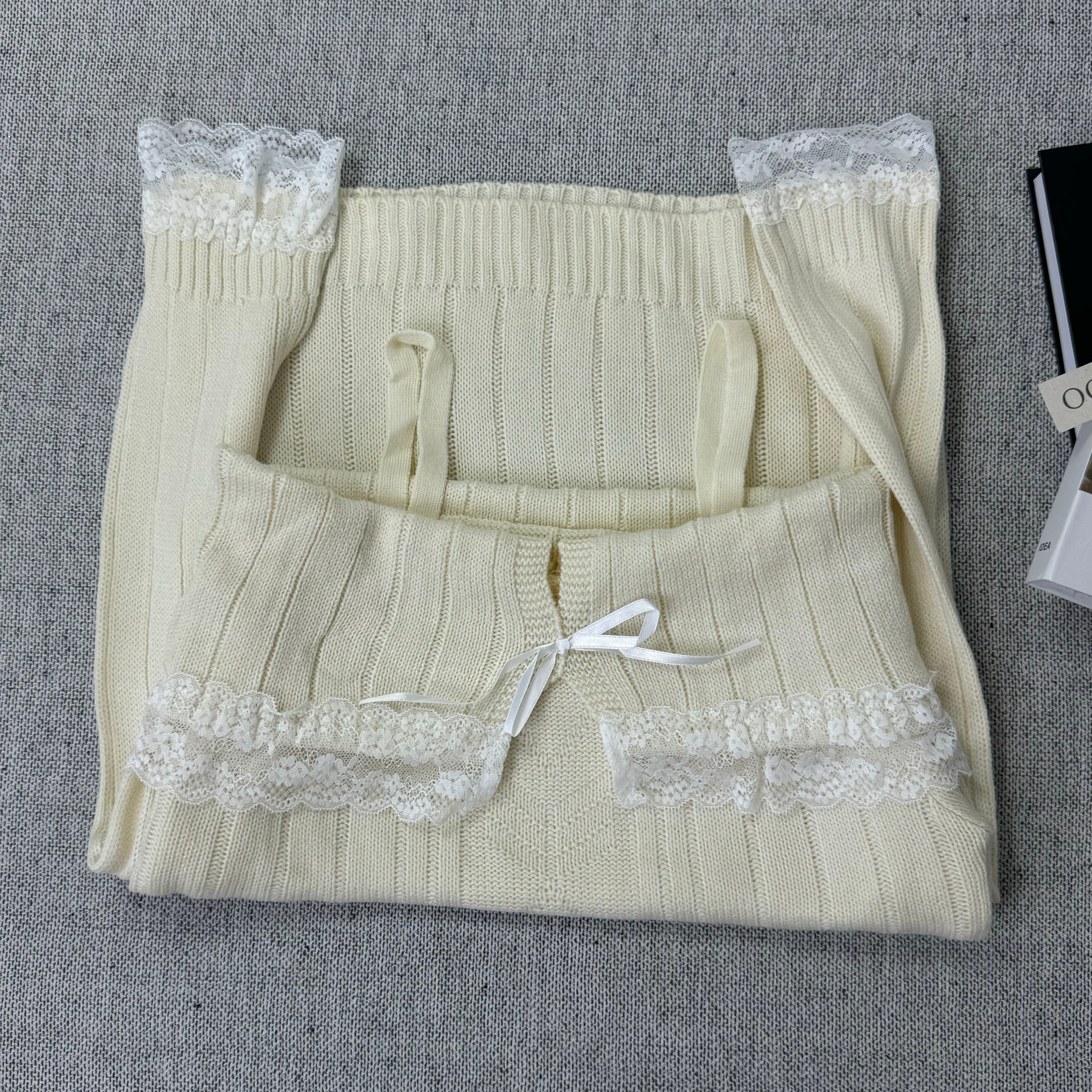 Lace trimmed one-shoulder sweater