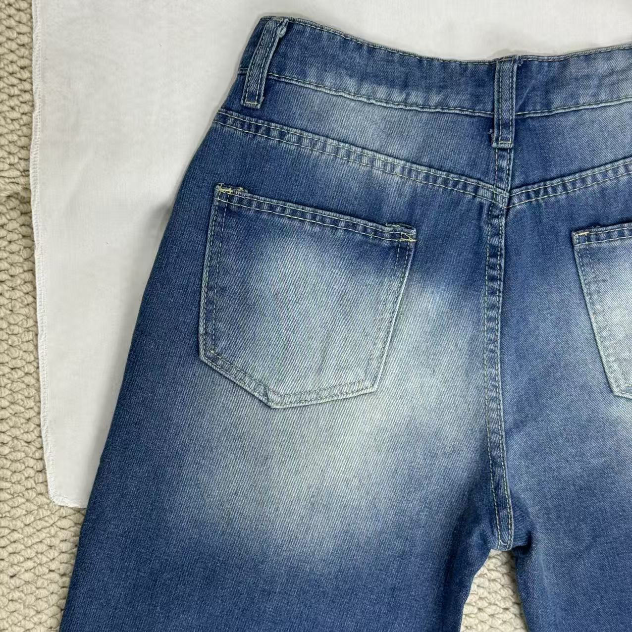High-Waisted Ripped Jeans