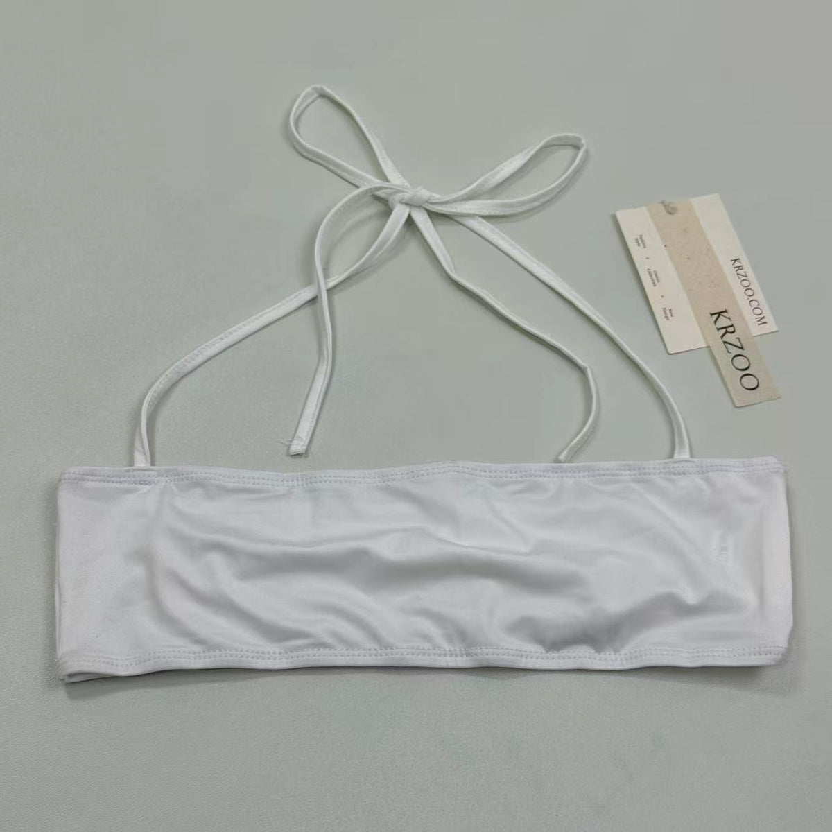 Cotton one-piece neckless plunging top